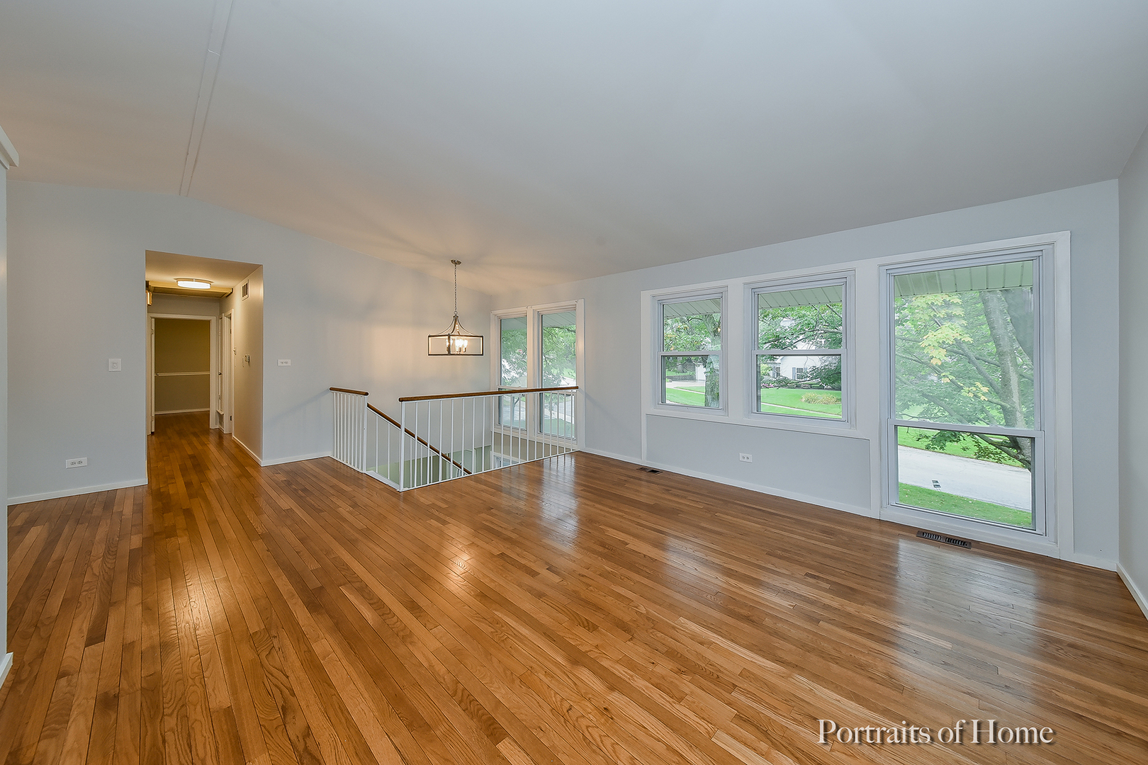 2S645 Bob O Link Road Lombard, IL 60148 - Photo 2 of 18 a view of a bedroom with wooden floor and windows