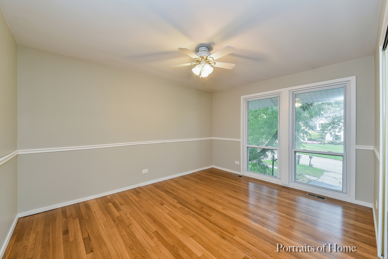 2S645 Bob O Link Road Lombard, IL 60148 - Photo 5 of 18 wooden floor in an empty room with a window