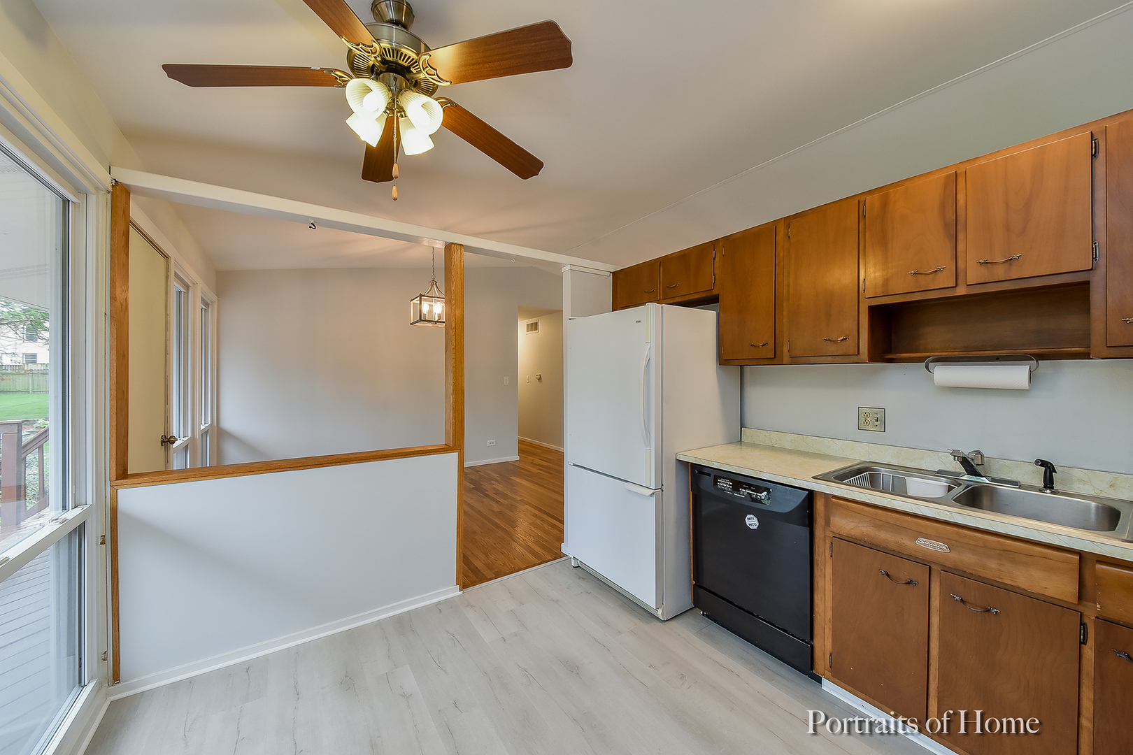 2S645 Bob O Link Road Lombard, IL 60148 - Photo 7 of 18 a kitchen with stainless steel appliances granite countertop a refrigerator a oven a sink with a dining table and chairs