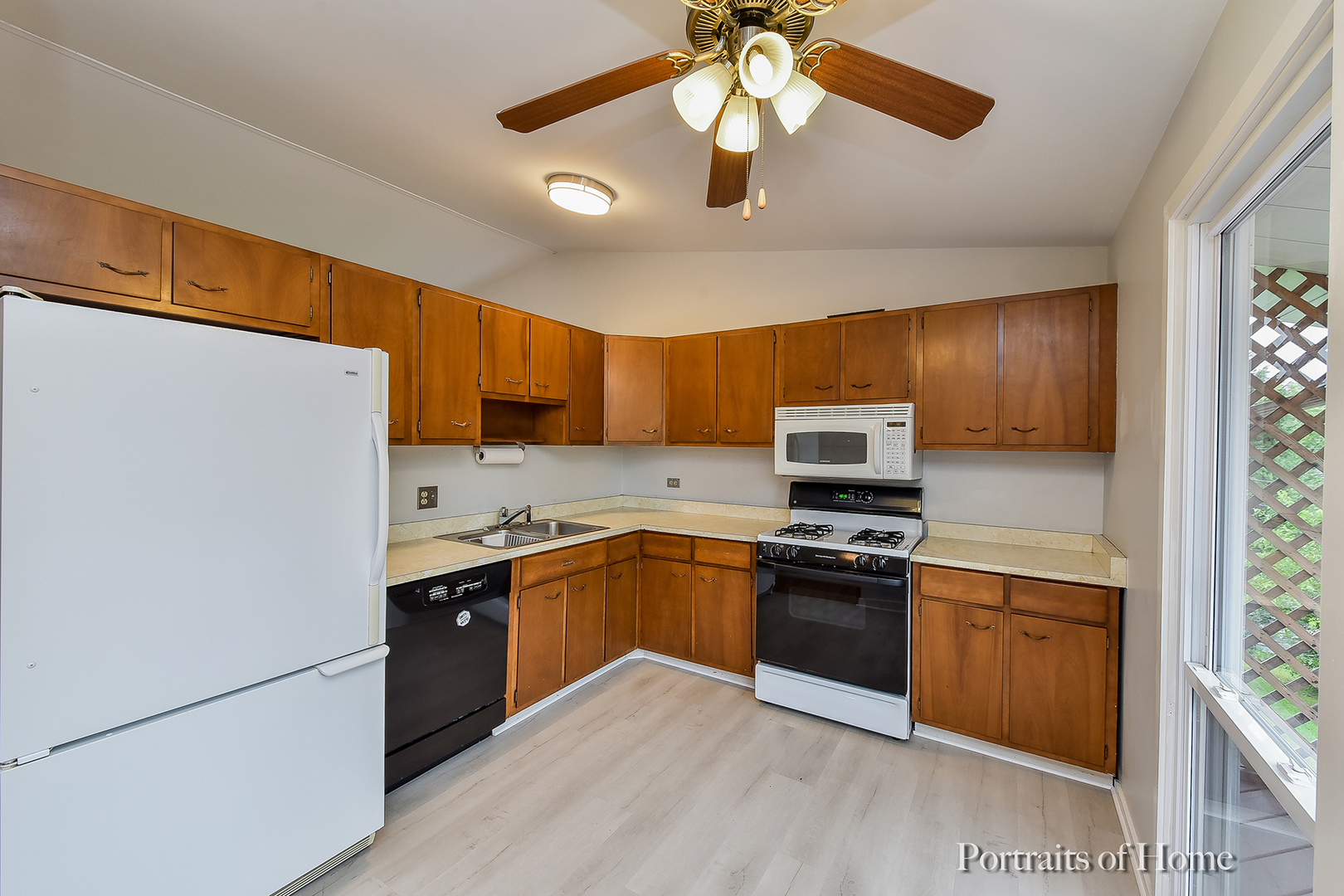 2S645 Bob O Link Road Lombard, IL 60148 - Photo 9 of 18 a kitchen with stainless steel appliances granite countertop a stove top oven a sink and dishwasher