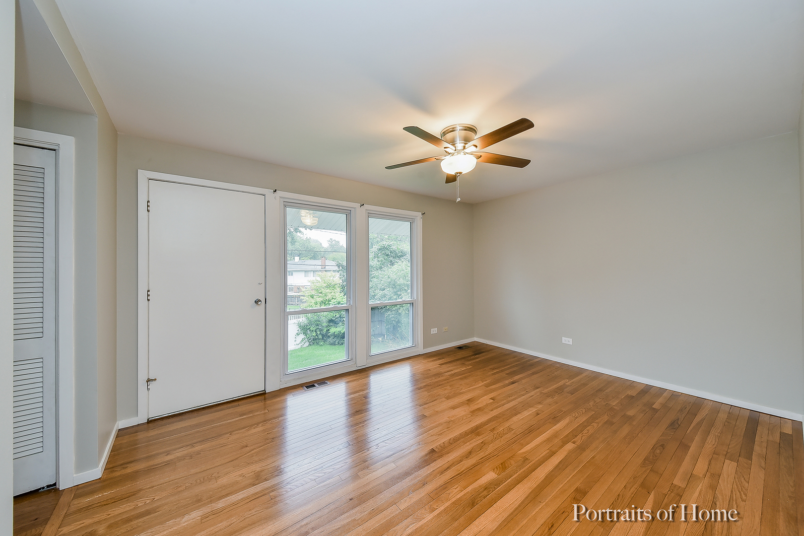 2S645 Bob O Link Road Lombard, IL 60148 - Photo 10 of 18 an empty room with wooden floor and windows