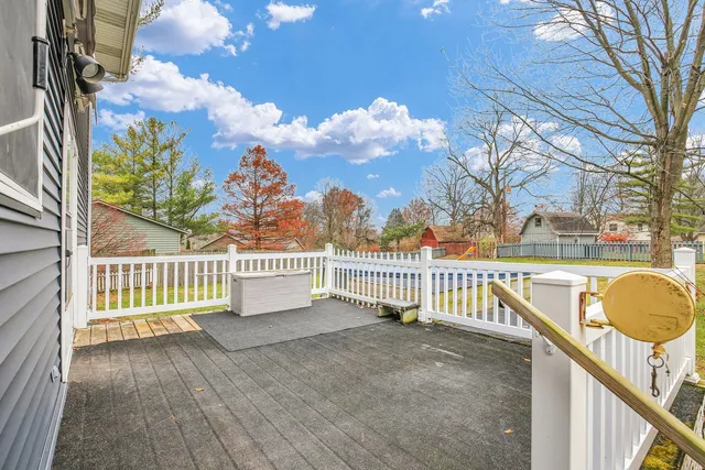 an empty room with closet and fan