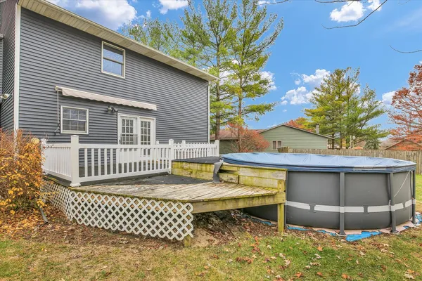 a bathroom with a granite countertop sink a toilet and a mirror