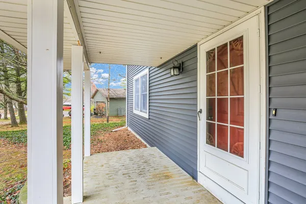 a view of a balcony with wooden fence