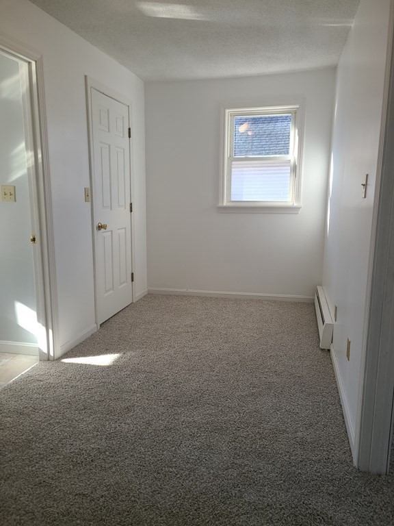 80 West Main Street Ware, MA 01082 - Photo 11 of 27 en empty room with windows and closet