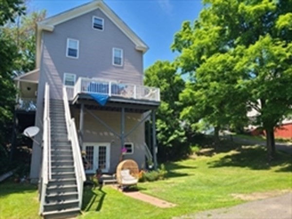 80 West Main Street Ware, MA 01082 - Photo 2 of 27 a front view of a house with garden