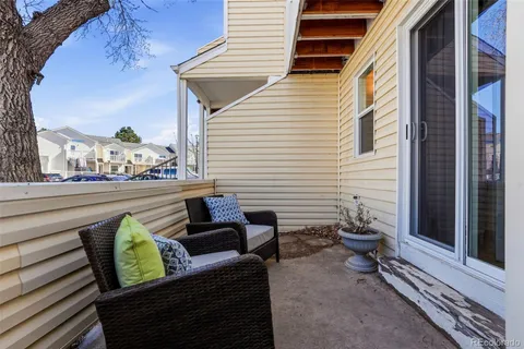 a view of a balcony with chairs