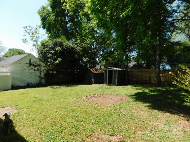326 South Cedar Street Lincolnton, NC 28092 - Photo 14 of 16 a backyard of a house with lots of green space