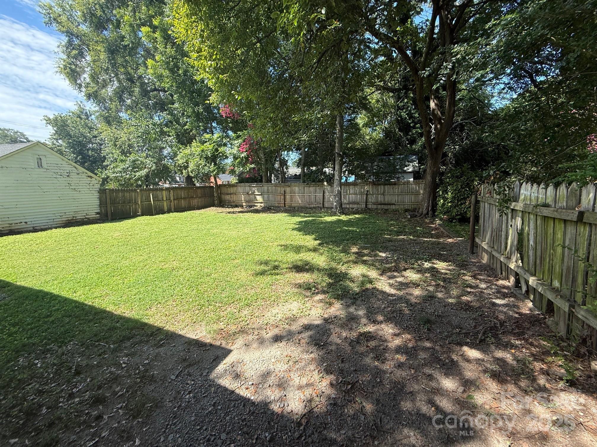 326 South Cedar Street Lincolnton, NC 28092 - Photo 15 of 16 a view of a backyard with large trees