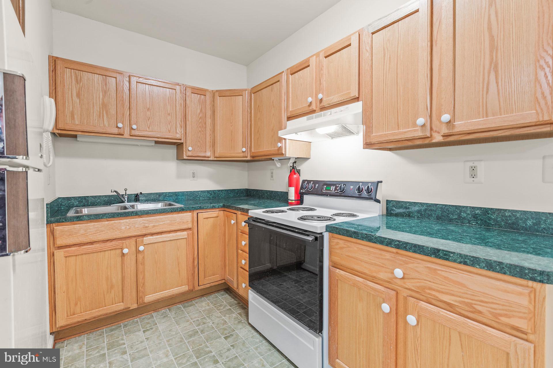 3200 Hickory Ridge Road Dunkirk, MD 20754 - Photo 31 of 44 a kitchen with stainless steel appliances granite countertop a stove a sink and dishwasher