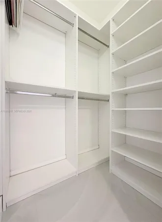 a bathroom that has a glass shower door