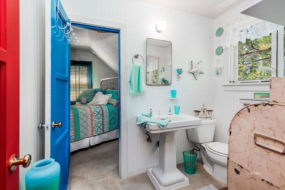 25440 Fern Valley Road Idyllwild, CA 92549 - Photo 27 of 32 a bathroom with a sink mirror and toilet