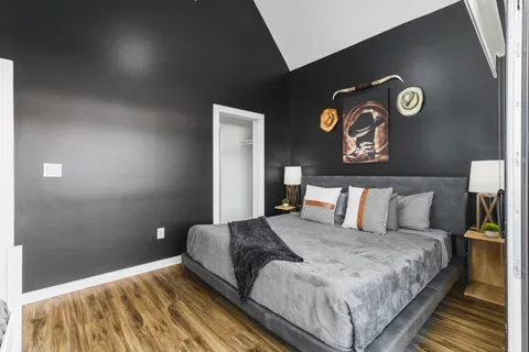 a living room with furniture and a floor to ceiling window