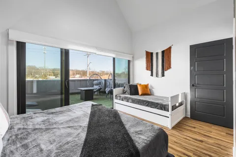 a view of a house with backyard and porch