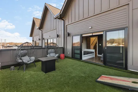 a view of a backyard with sitting area