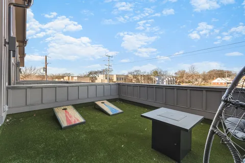 a view of a roof deck with couches