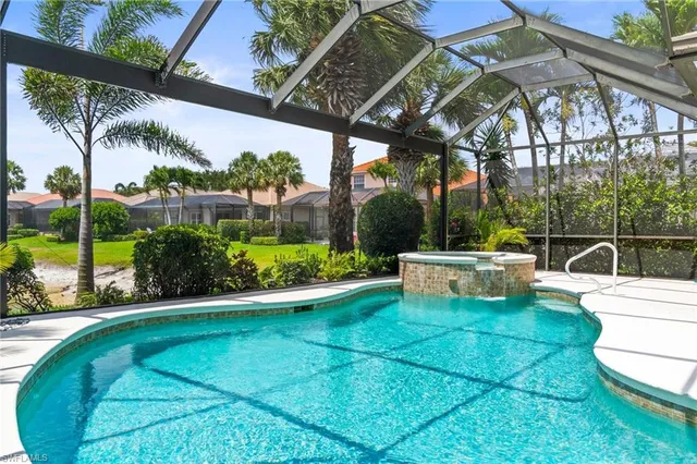 a view of a white house with a yard