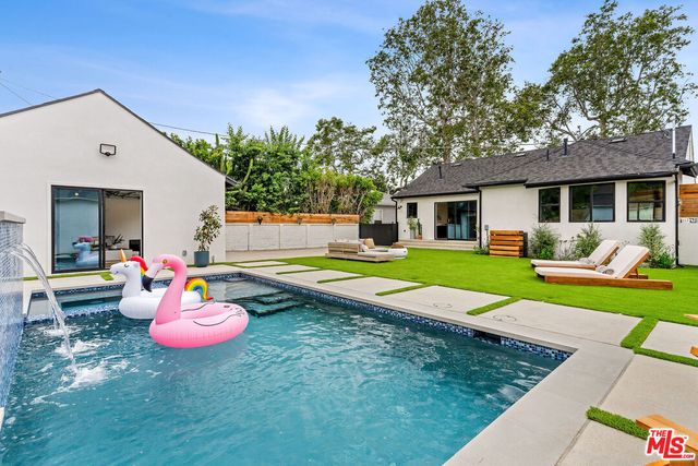 a view of a house with a yard porch and sitting area