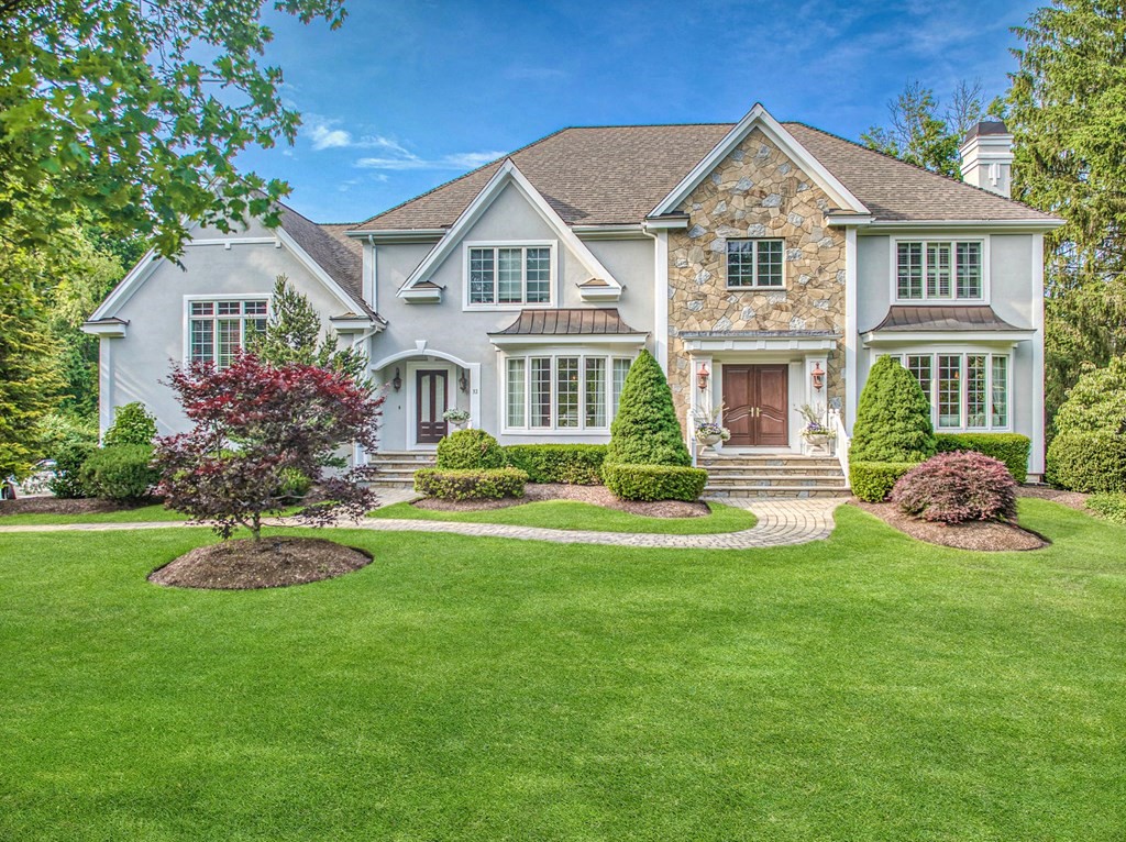 32 Bancroft Road Andover, MA 01810 - Photo 1 of 41 a front view of a house with a garden