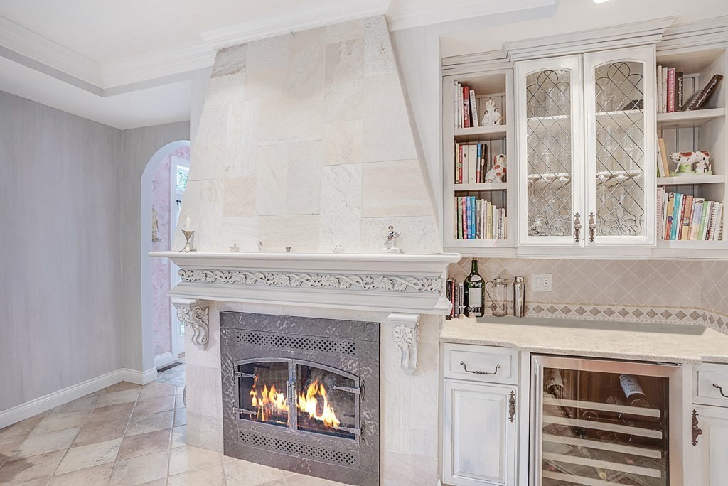 32 Bancroft Road Andover, MA 01810 - Photo 12 of 41 a living room with a fireplace and a fireplace