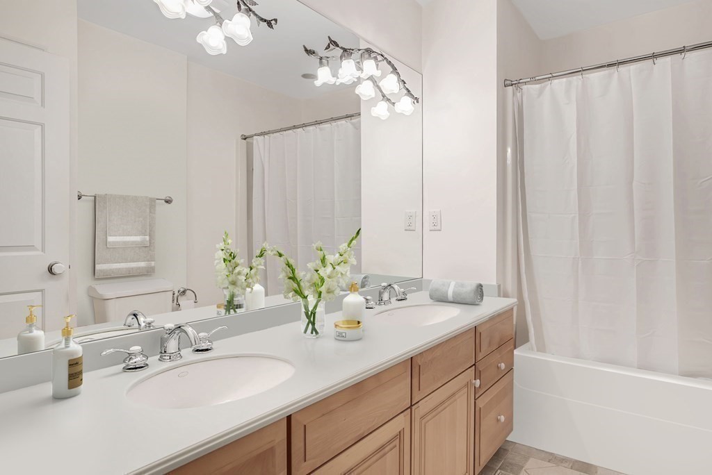 32 Bancroft Road Andover, MA 01810 - Photo 38 of 41 a bathroom with a double vanity sink and a mirror