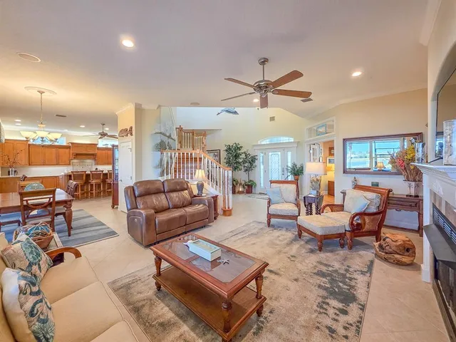 a bedroom with bed and a large window