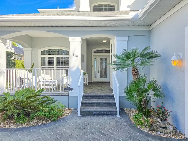 a large kitchen with kitchen island a sink a counter top space and stainless steel appliances
