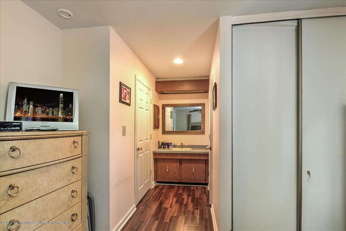 6 Timberline Drive Howell, NJ 07731 - Photo 11 of 12 a bathroom with a sink a mirror and a shower