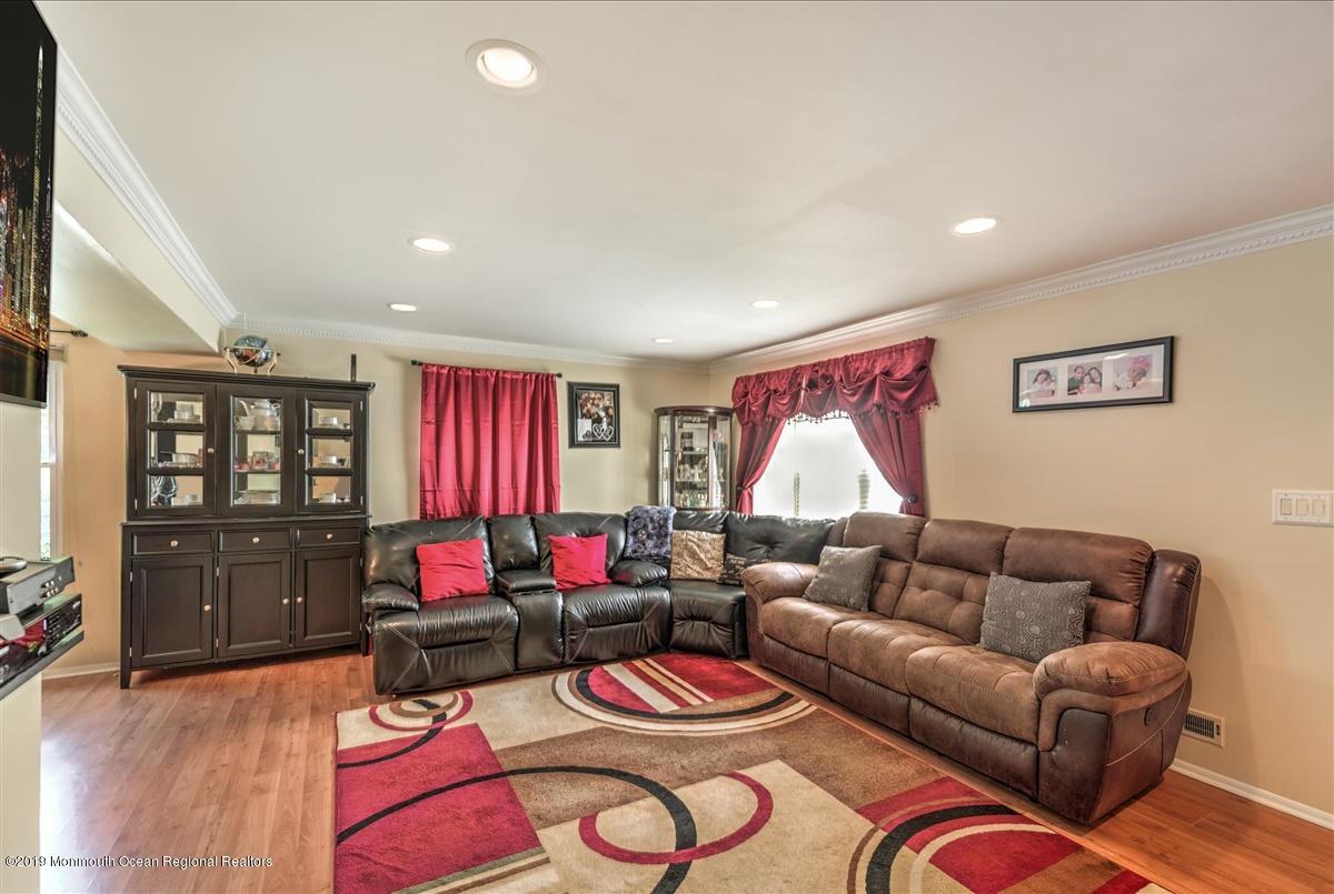 6 Timberline Drive Howell, NJ 07731 - Photo 2 of 12 a living room with furniture and wooden floor