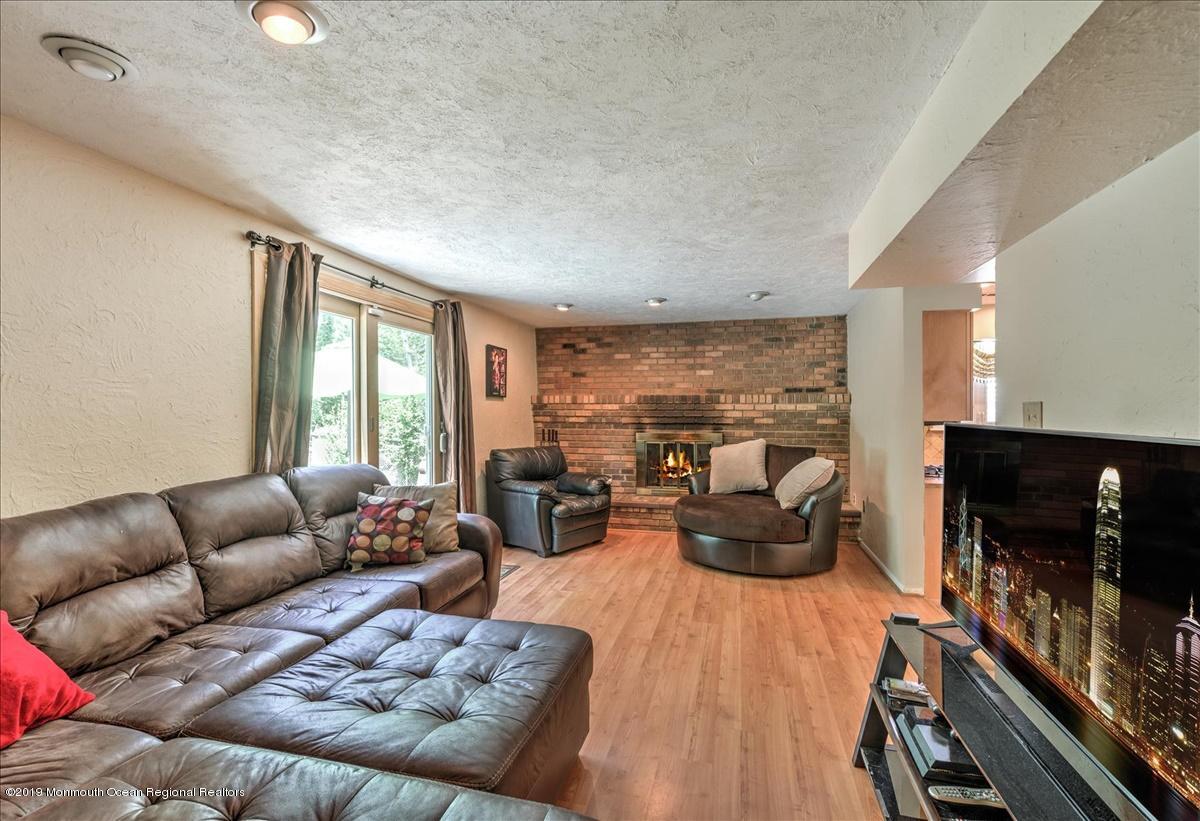 6 Timberline Drive Howell, NJ 07731 - Photo 6 of 12 a living room with furniture and a flat screen tv
