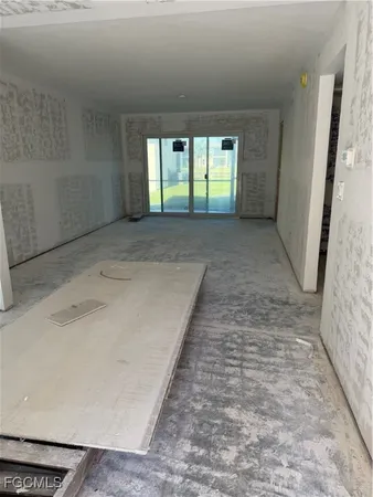a view of an empty room with a fireplace