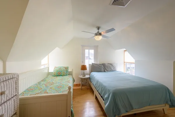 a bedroom with a bed and window