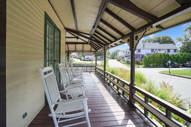 a view of two chairs in the balcony