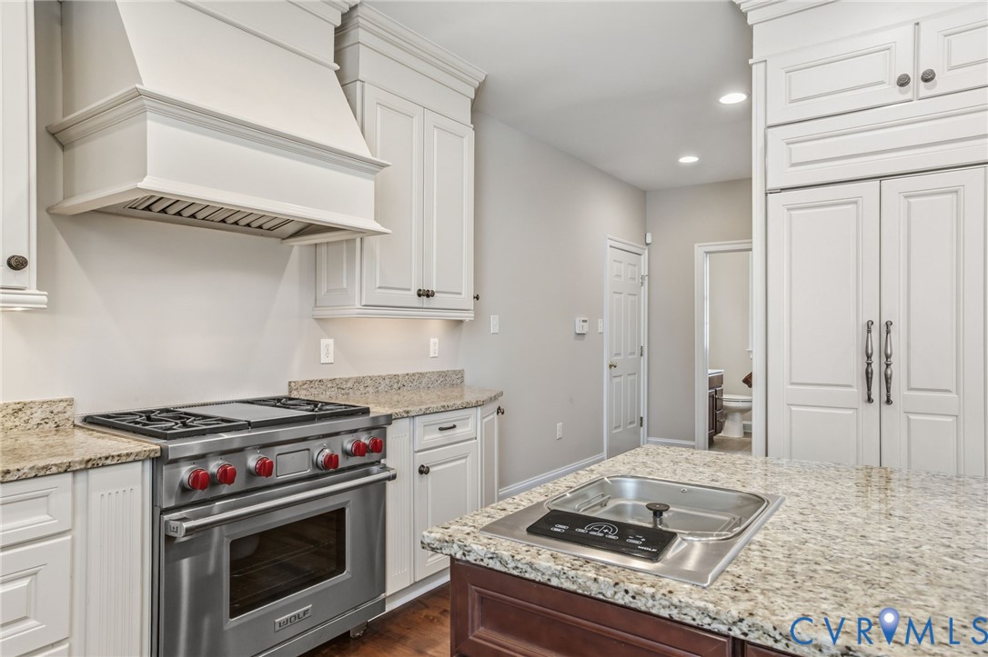 3100 Sodbury Court Midlothian, VA 23113 - Photo 20 of 94 a kitchen with stainless steel appliances granite countertop a stove and a sink