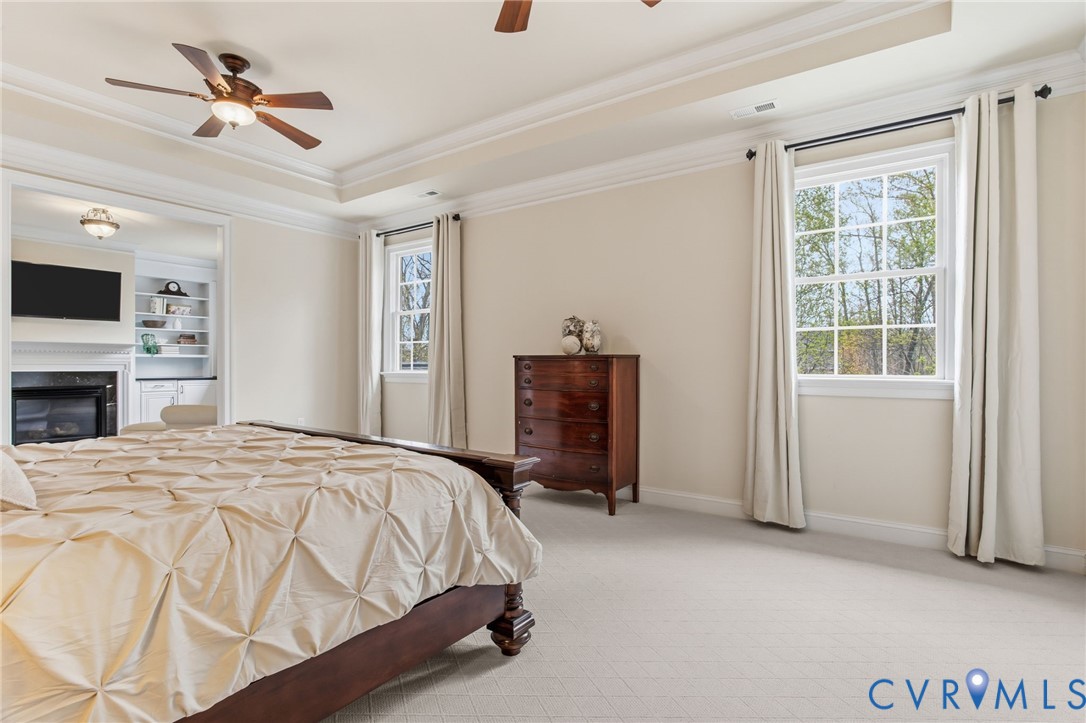 3100 Sodbury Court Midlothian, VA 23113 - Photo 37 of 94 a spacious bedroom with a bed and a chandelier