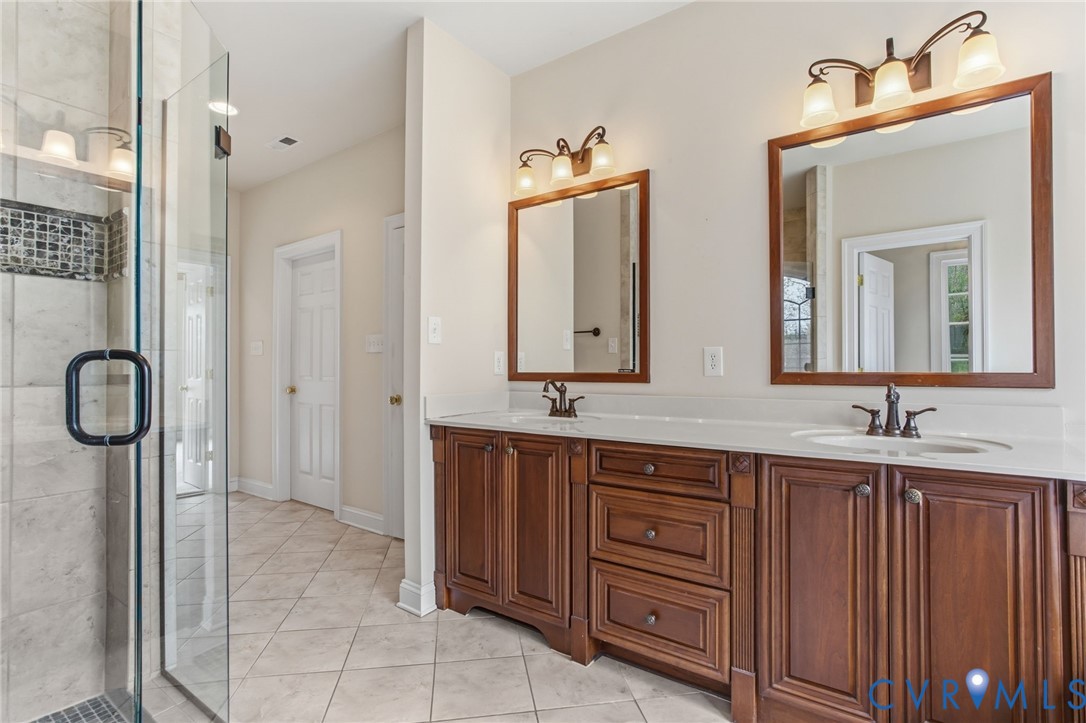 3100 Sodbury Court Midlothian, VA 23113 - Photo 40 of 94 a bathroom with a granite countertop sink and a mirror
