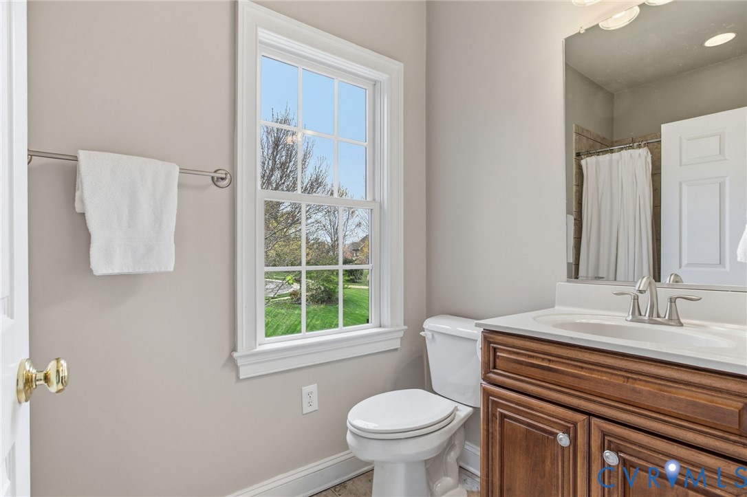 3100 Sodbury Court Midlothian, VA 23113 - Photo 54 of 94 a bathroom with a sink a toilet and a mirror