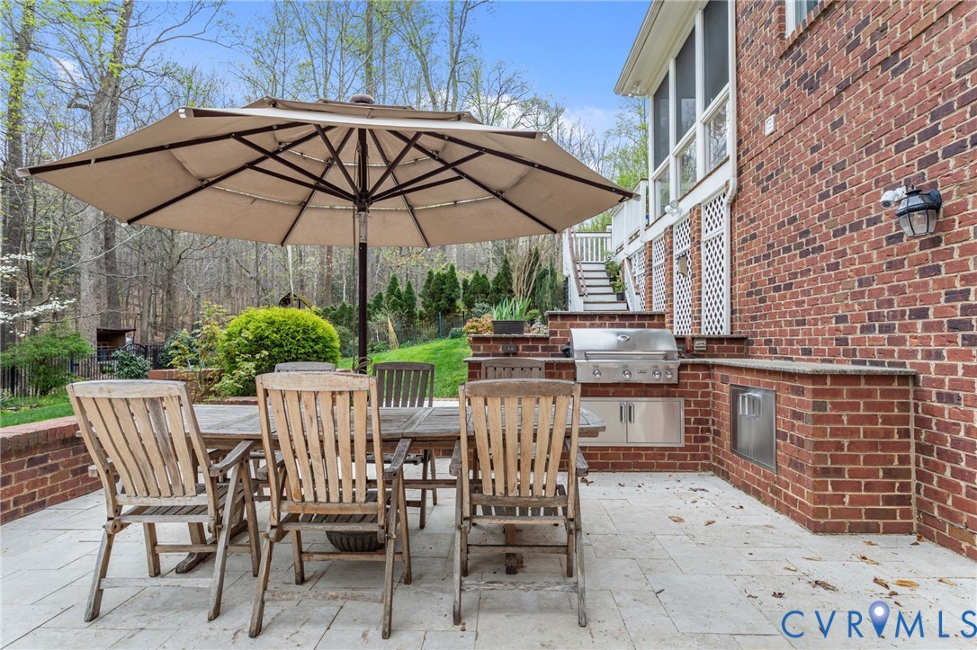 3100 Sodbury Court Midlothian, VA 23113 - Photo 73 of 94 a view of patio with chairs and table under an umbrella