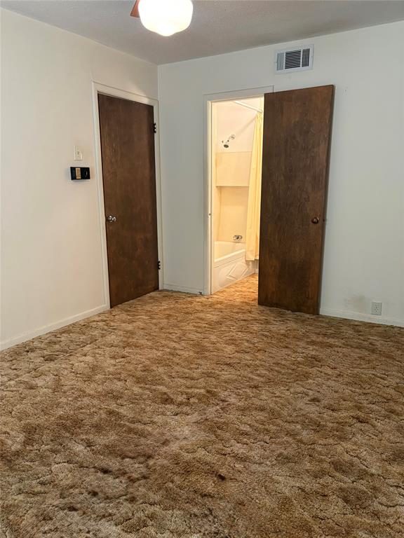 1387 Hickory Street Rhome, TX 76078 - Photo 16 of 36 Large second primary bedroom with bathroom adjacent.