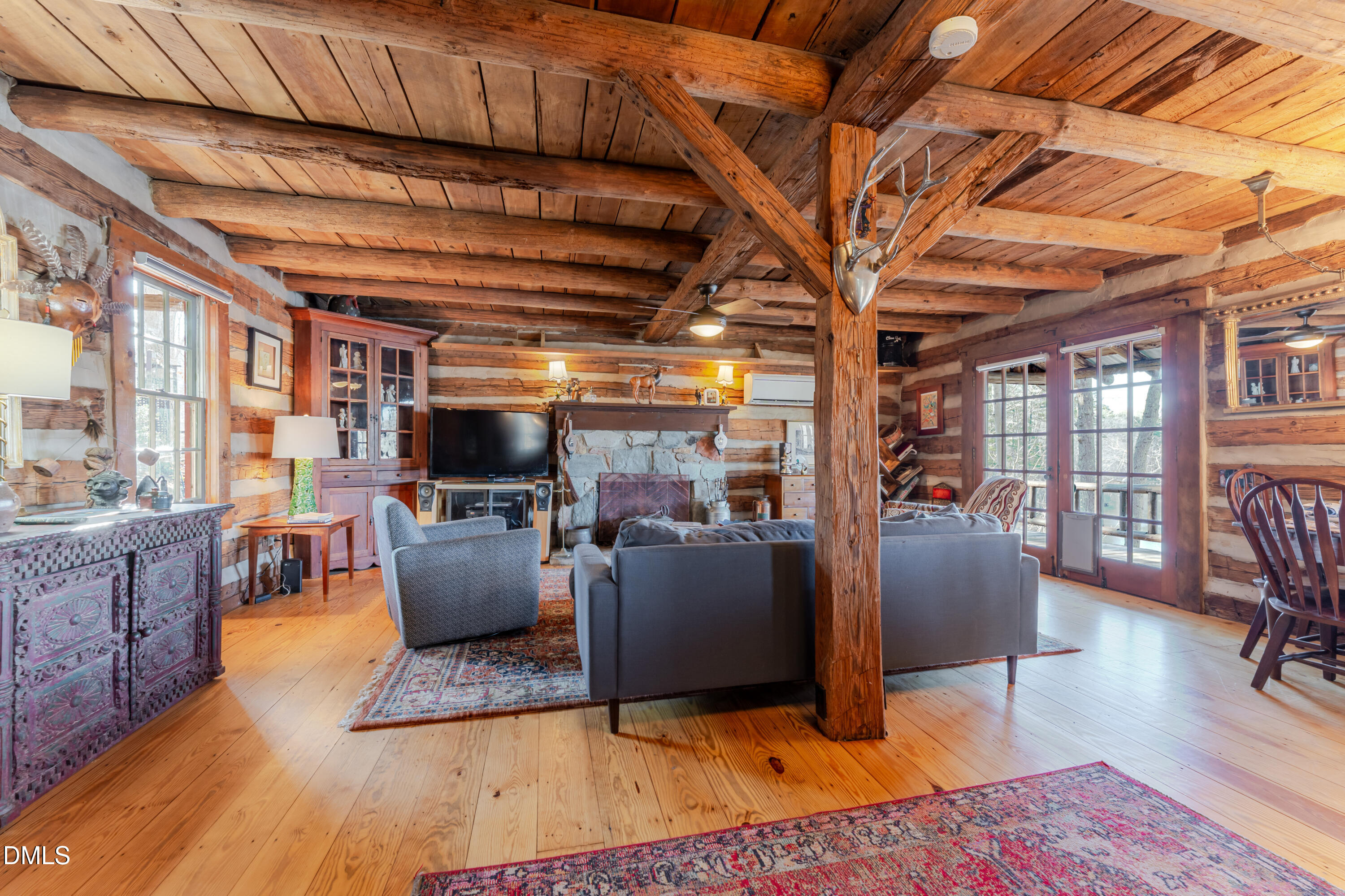954 Huff Garrett Road Roxboro, NC 27574 - Photo 16 of 98 a living room with furniture and a flat screen tv