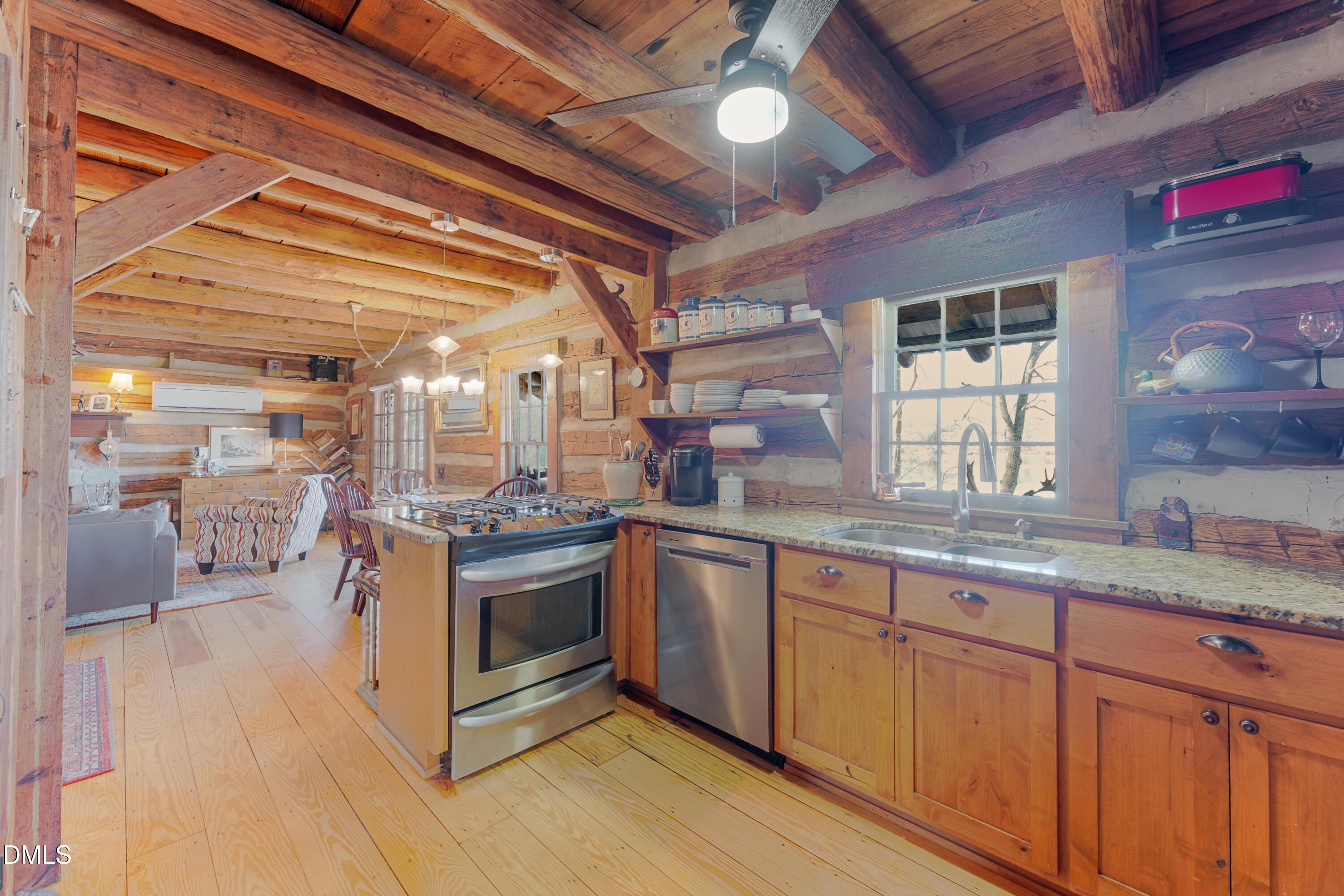 954 Huff Garrett Road Roxboro, NC 27574 - Photo 30 of 98 a kitchen with stainless steel appliances granite countertop a stove and cabinets
