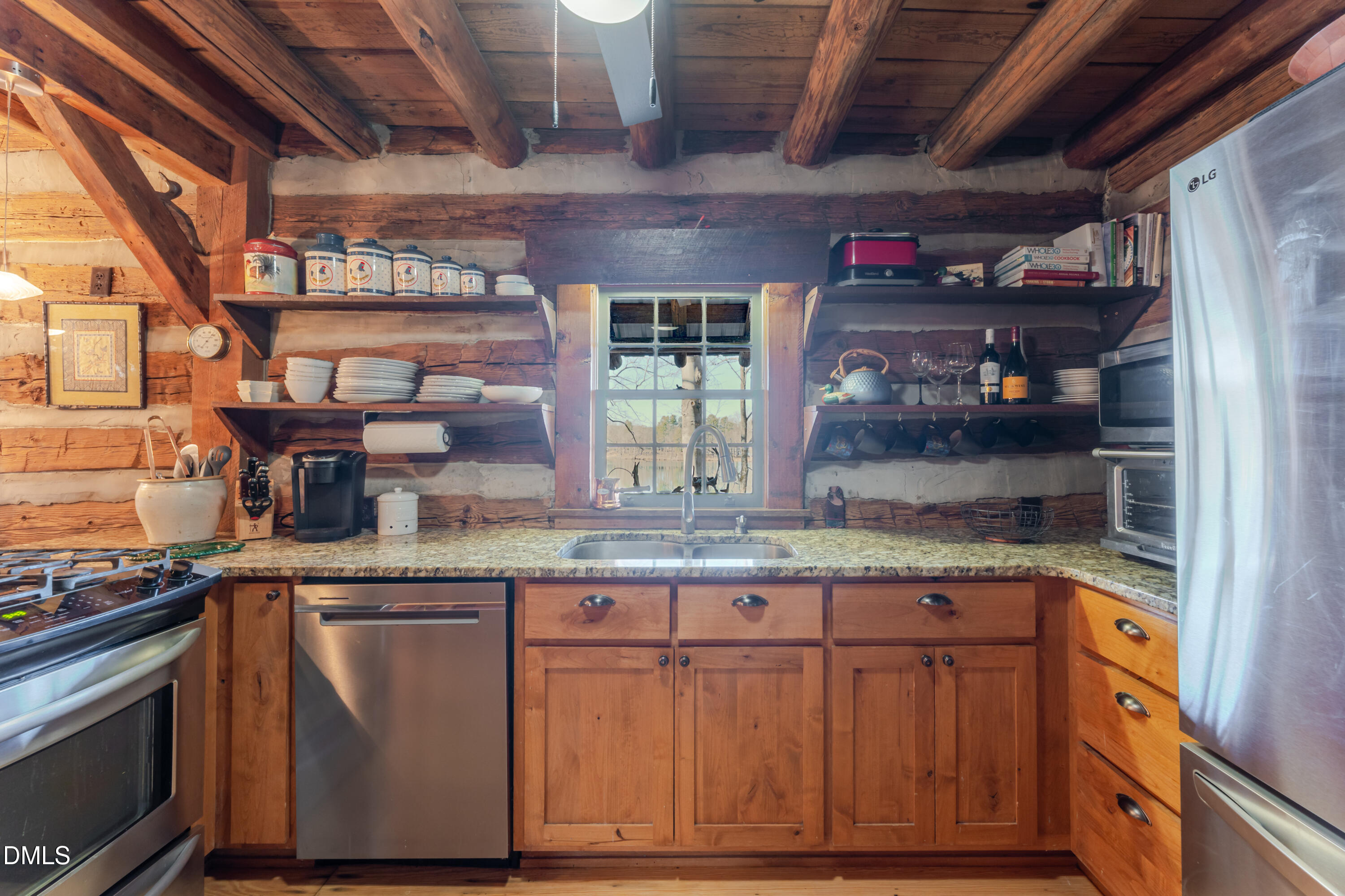 954 Huff Garrett Road Roxboro, NC 27574 - Photo 31 of 98 a kitchen with granite countertop wooden cabinets and a stainless steel appliances
