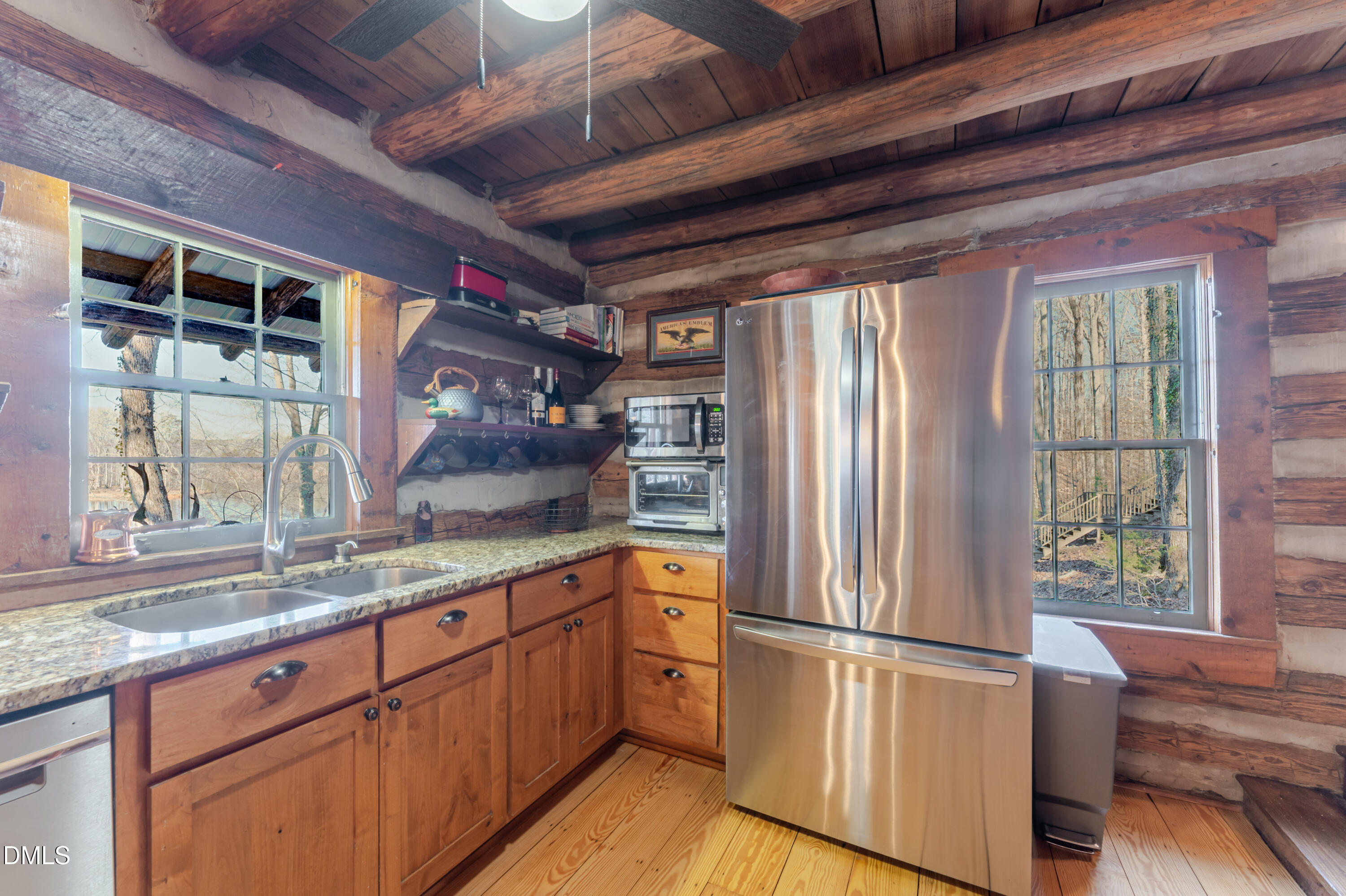 954 Huff Garrett Road Roxboro, NC 27574 - Photo 32 of 98 a kitchen with stainless steel appliances a refrigerator and a sink