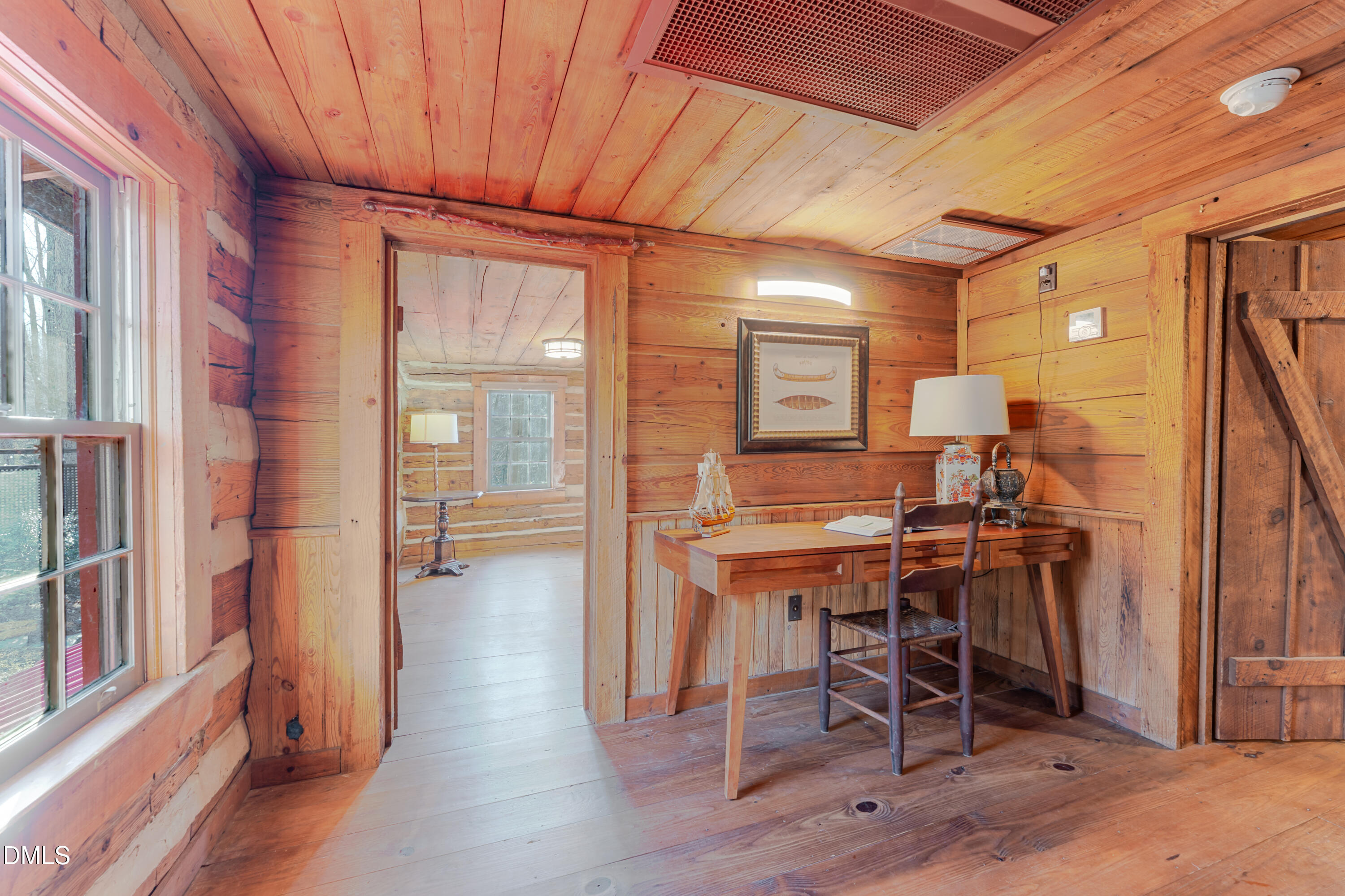 954 Huff Garrett Road Roxboro, NC 27574 - Photo 37 of 98 a view of a room with furniture and wooden floor
