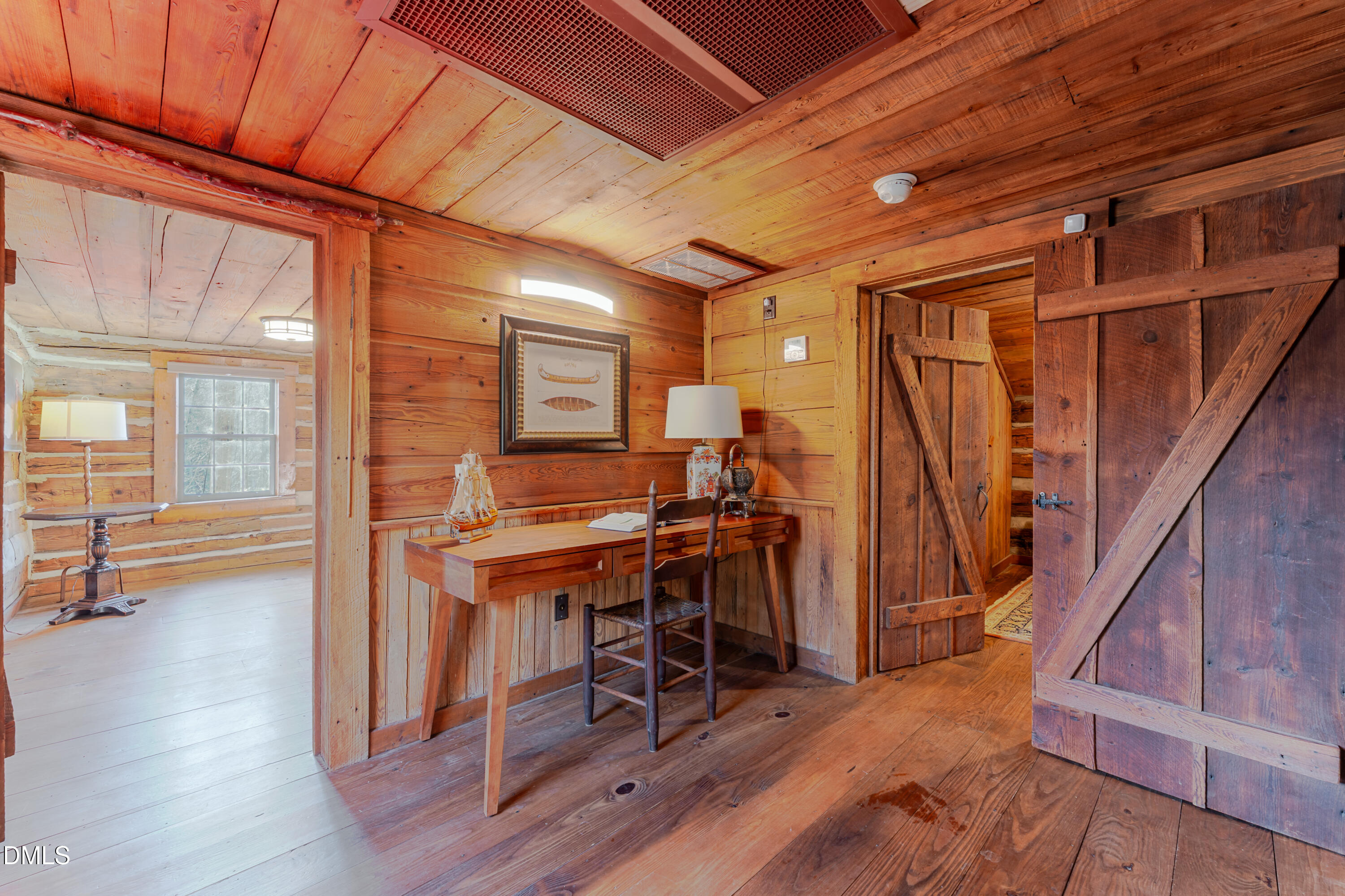 954 Huff Garrett Road Roxboro, NC 27574 - Photo 38 of 98 a view of a room with wooden floor and furniture