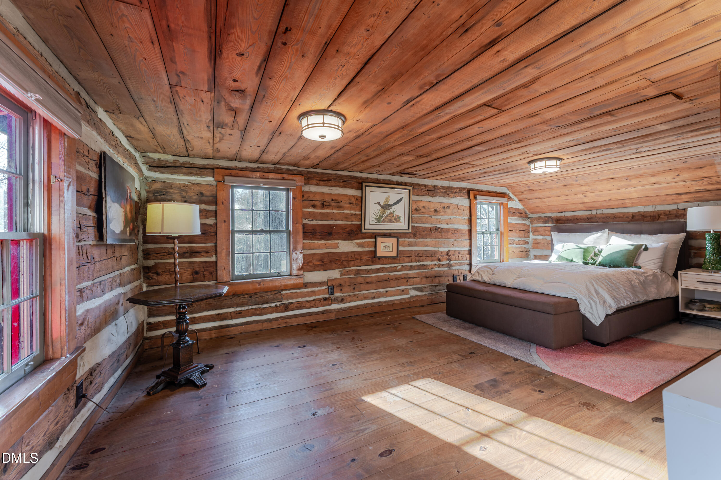954 Huff Garrett Road Roxboro, NC 27574 - Photo 43 of 98 a bedroom with furniture and wooden floor