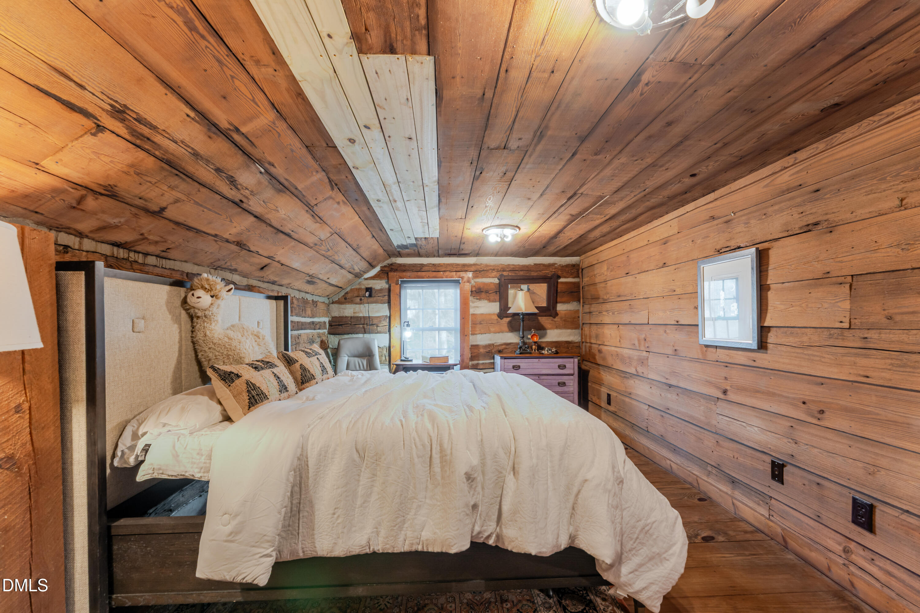 954 Huff Garrett Road Roxboro, NC 27574 - Photo 51 of 98 a bed room with a bed and a large window