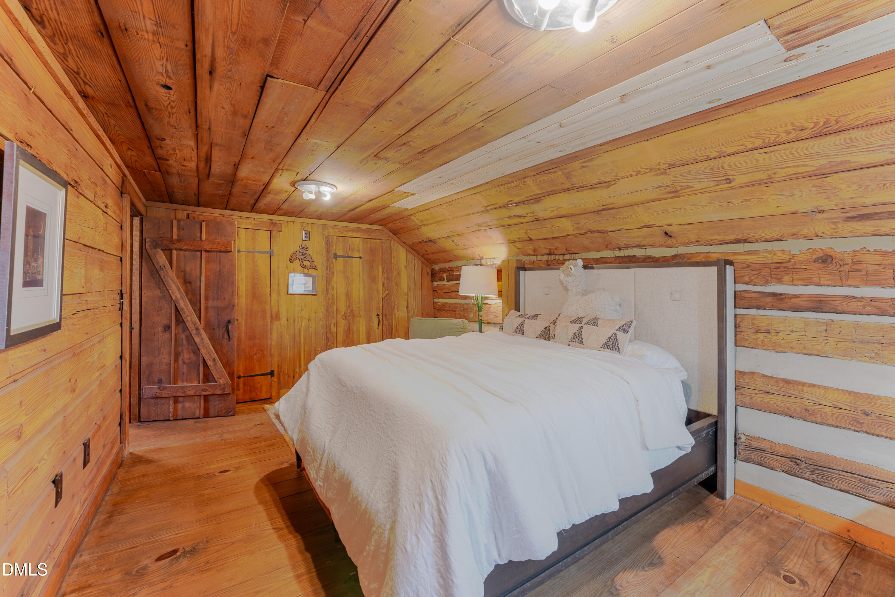 954 Huff Garrett Road Roxboro, NC 27574 - Photo 53 of 98 a bed sitting in a spacious bedroom next to a window