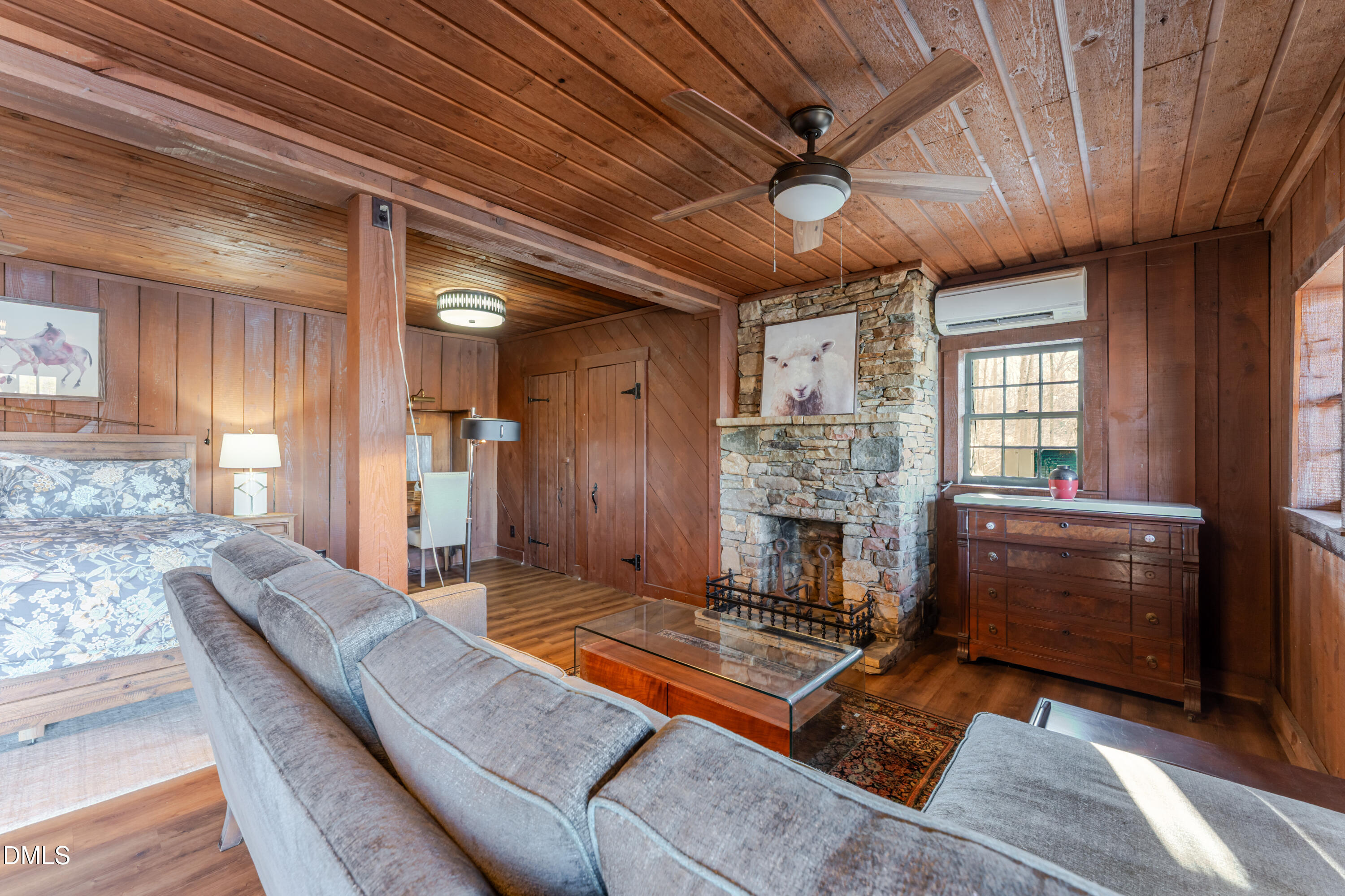 954 Huff Garrett Road Roxboro, NC 27574 - Photo 59 of 98 a living room with furniture flat screen tv and a fireplace