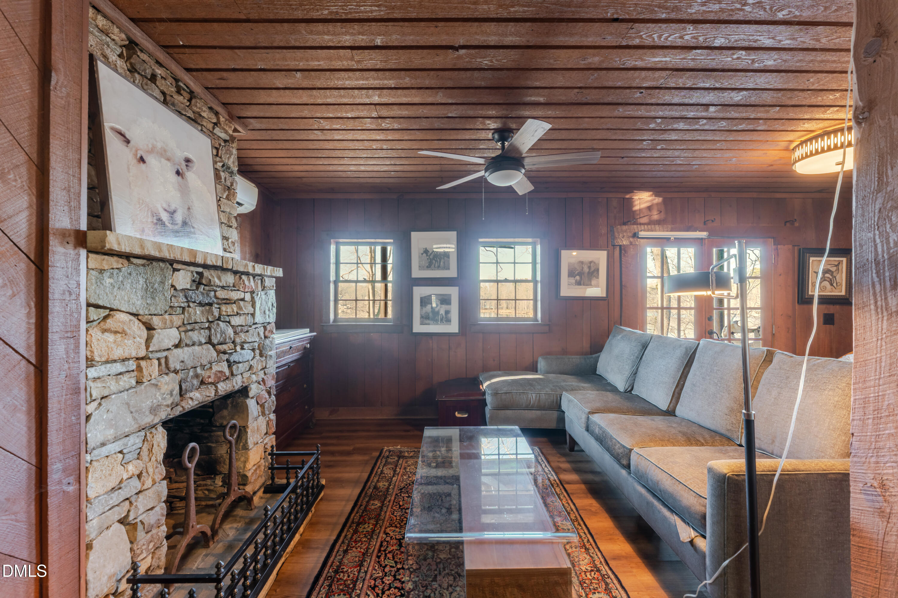 954 Huff Garrett Road Roxboro, NC 27574 - Photo 61 of 98 a living room with furniture a fireplace and a ceiling fan